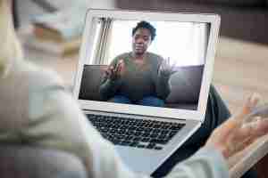 woman on video telepsychiatry session with a PreferNP Provider